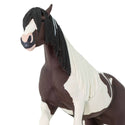 Brown and cream horse with a flowy tail and  mane