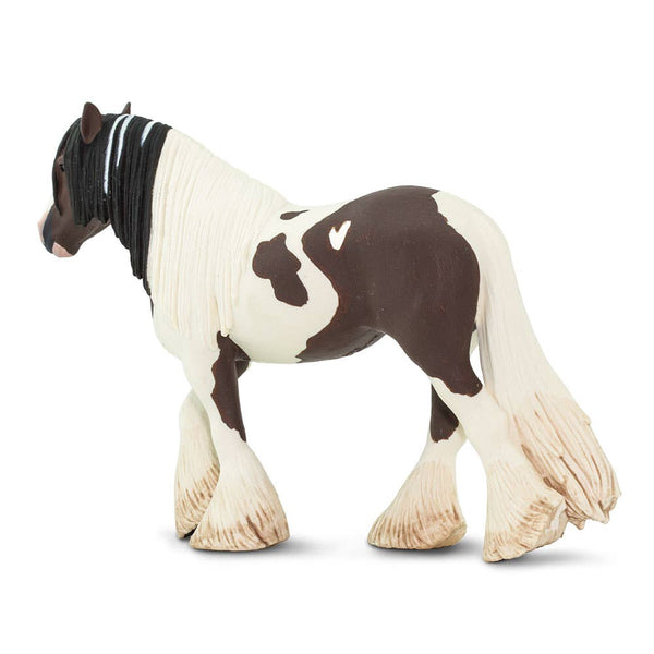 Brown and cream horse with a flowy tail and  mane