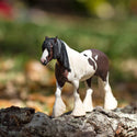 Brown and cream horse with a flowy tail and  mane