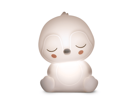 White cartoon-like night light with a neutral expression on a white background
