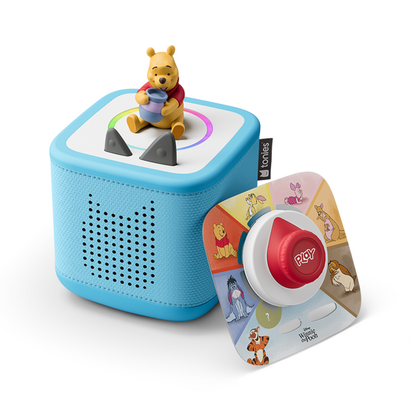Toy with a bear figure on top, blue base, and a circular control with 'Play' button, featuring Disney characters.