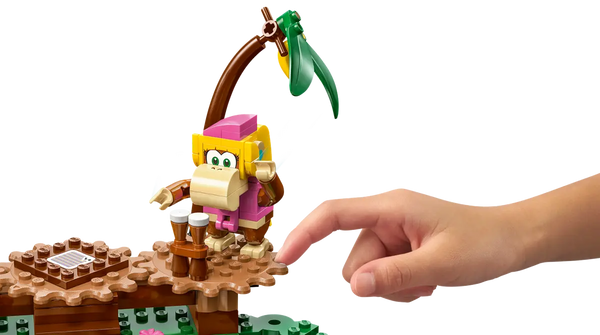 dixie kong sitting on a gear block with someone turning the gear