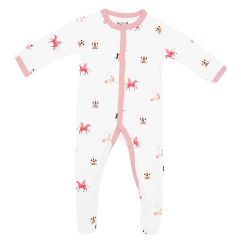 White romper with pink unicorns and castles on it. Arm cuffs, neck and zipper trim are pink.