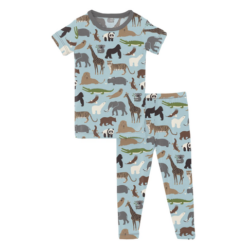 Pajama Set with Short Sleeve Tshirt and long fitted pants. Solid stormy Sky blue background with cartoon zoo animals all over. Pandas, Crocodiles, Lions, Tigers, Giraffes, Koalas, Hippos, Gorilla, Elephants, and Platypus