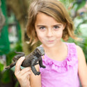 Little girl holding the Komodo dragon