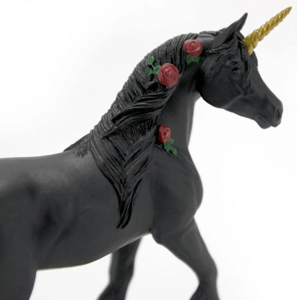 The Twilight Unicorn's striking black coloration stands in dark contrast to its white counterpart. Its hooves and horn are a gleaming gold, and red roses are entwined in its mane.&nbsp;