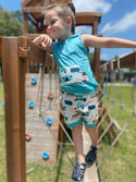 Child in sleeveless hoodie and shorts with camper on them