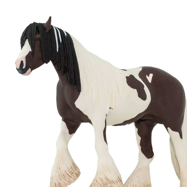 Brown and cream horse with a flowy tail and  mane