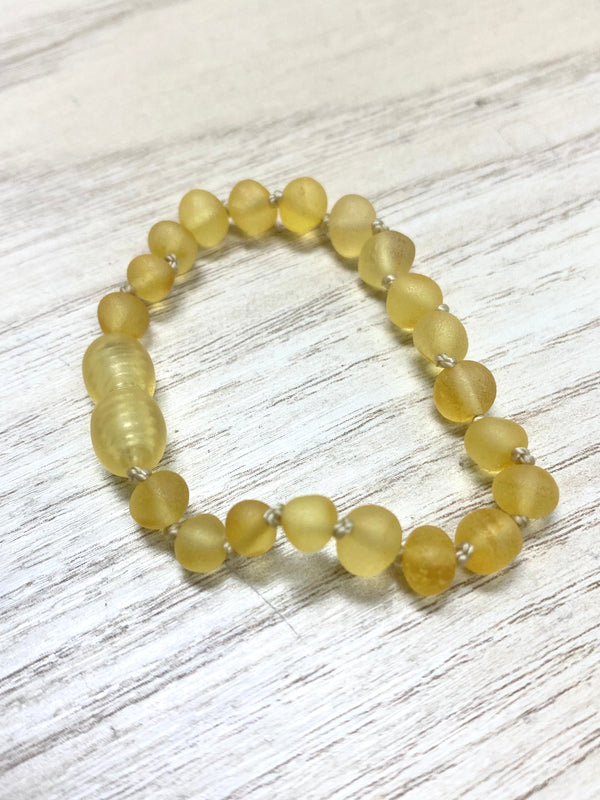 Lemon Raw baltic amber round beads strung together