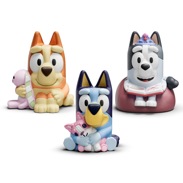 Three colorful dog figurines on a white background.