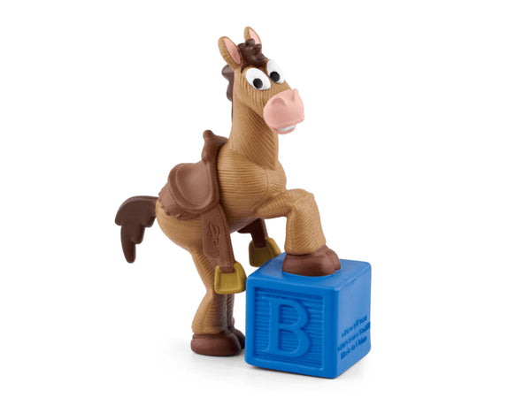 Toy horse figure with a blue block featuring the letter 'B' on a white background