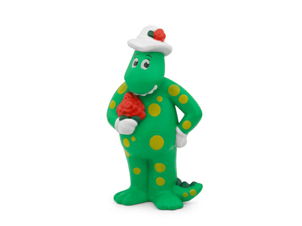 Green polka dot character with a red flower on a white background
