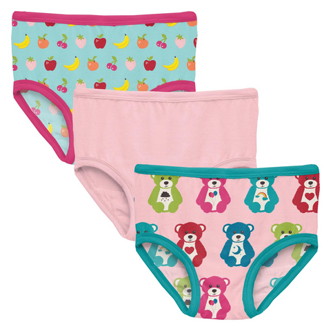 3 pairs of underwear. 1st has a light aqua canvas with colorful fruits all over it with pink trims.2nd is solid light pink. 3rd is light pink canvas with colorful carebears