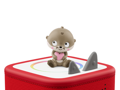 a brown otter sitting holding a pink heart