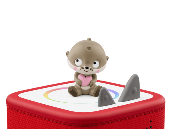 a brown otter sitting holding a pink heart