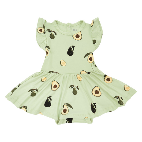 An all-over print featuring unripe avocados on the branch, whole and halved ripe avocados with their stems and leaves, and halved avocados with their pits, over a soft yellow green background color called Pistachio.