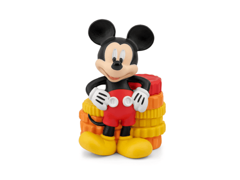 Mickey Mouse figurine with a stack of colorful blocks on a white background
