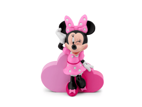 Minnie Mouse figurine with pink dress and bow on a white background