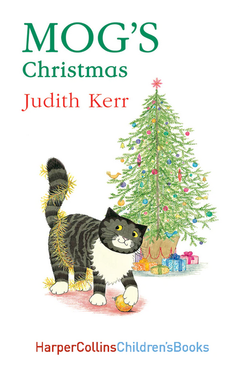 Mog in front of a decorated Christmas tree
