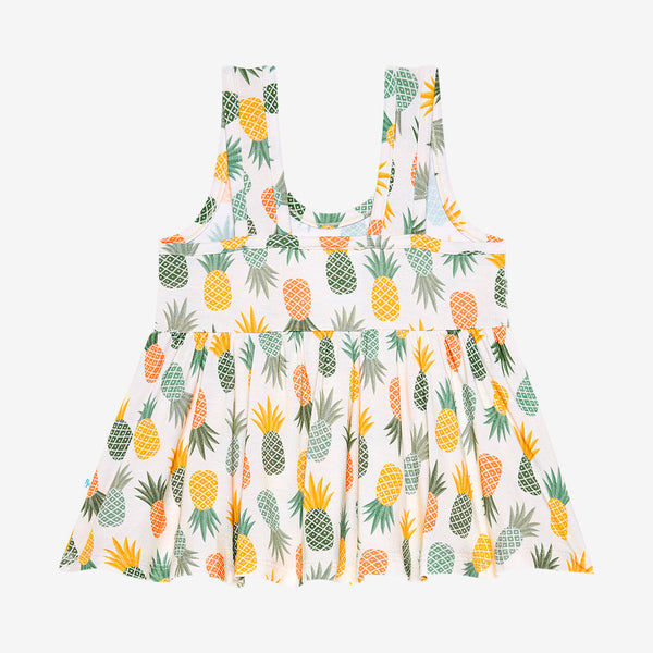 Back of Peplum Top that has the Light Green, Dark Green, Orange, and Yellow Pineapple print all over.