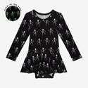 Black long sleeve twirl bodysuit with white dancing skulls that glow in the dark.