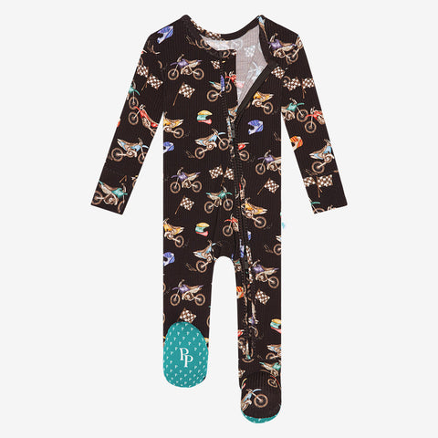 Zippered footie in supermini print. Print is black with mini dirt bikes and flags.