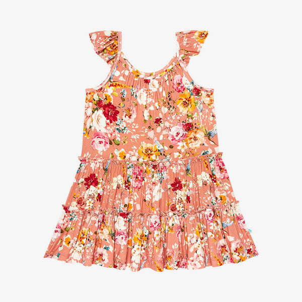Tiered flutter sleeve dress. Print is orange, red, yellow and white floral on a peachy background.