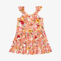 Tiered flutter sleeve dress. Print is orange, red, yellow and white floral on a peachy background.