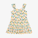 Flutter Sleeve Tiered dress has a white background with Pineapple print. Light Green, Dark green, Orange, and Yellow Pineapples are repeated all over with a white background
