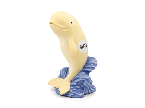 Toy beluga whale with a blue scarf on a white background