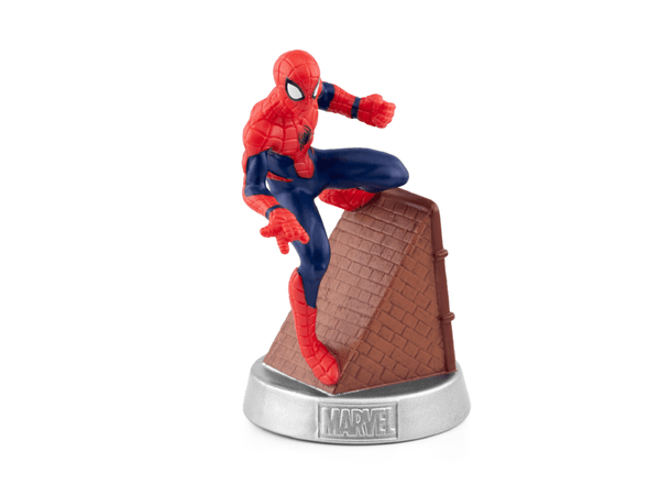 Spiderman figurine balancing on brown roof.