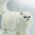 Its coat is white, its ears and nose are peach-colored, and its eyes are green.
