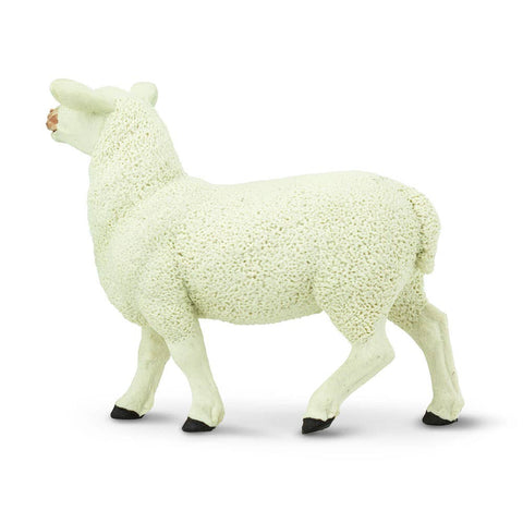 Primarily white, this 3-inch-long ewe features additional color on the hooves and about the face,