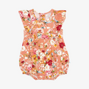 Flutter sleeve romper. Print is orange, red, yellow and white floral on a peachy background.