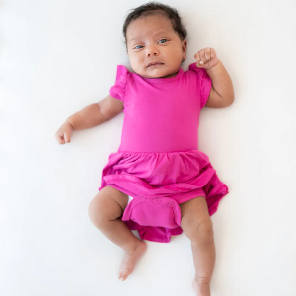Baby wearing Twirl bodysuit dress in Raspberry