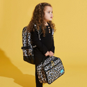 Girl holding Lunch bag with tan leopard print. Black trim and gold hardware
