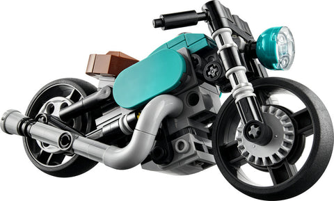 Lego Creator Vintage Motorcycle built. The motorcycle is teal and black. 