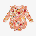 Long sleeve romp. Print is orange, red, yellow and white floral on a peachy background.