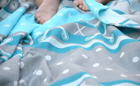 Cotton Baby wrap in aqua, blue, gray, and white.