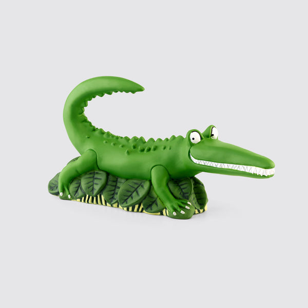 Tonies Enormous Crocodile character is a green crocodile with an big white toothed smile