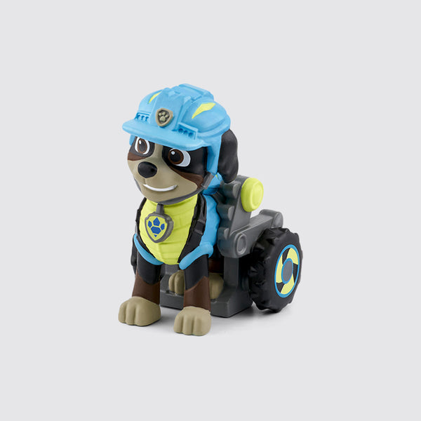 Tonies Paw Patrol Rex character is a brown dog with a blue and yellow suit