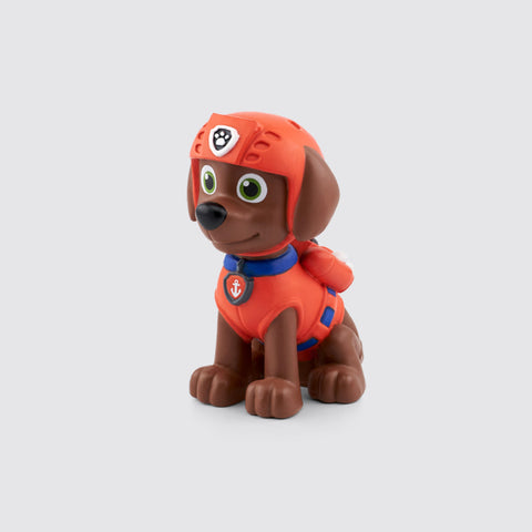 Tonies Paw Patrol Zuma character is a brown dog with a red suit.