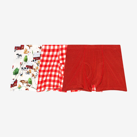 3 pack boys boxers. 1st print is Country farm print on a cream background, 2nd is white and red country checker, and 3rd is solid red.