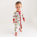 Toddler in one piece. Country farm print on a cream background. Zipper, wrists and foot cuffs are red.