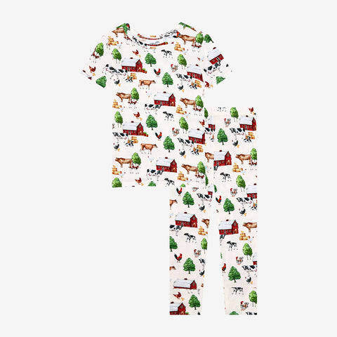 Short sleeved, long pants pajama set. Country farm print on a cream background.