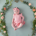 Baby girl in Bodysuit with flutter sleeves and twirl skirt in solid soft light pink color with matching headband. Headband sold separately