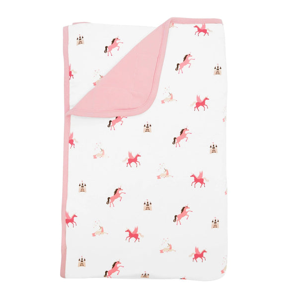Toddler blanket is white with pink unicorns and castles. Backing and trim are pink.
